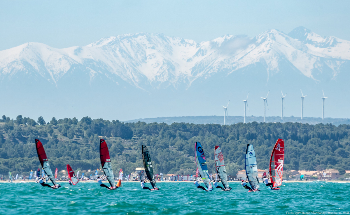 A regatta against the backdrop of the snow-capped peaks of the Pyrenees.