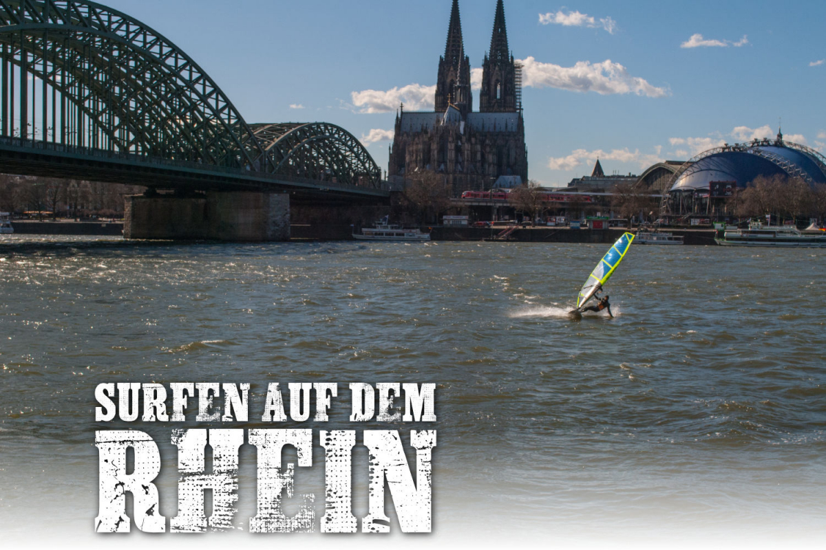 Surfen auf dem Rhein vor dem Kölner Dom